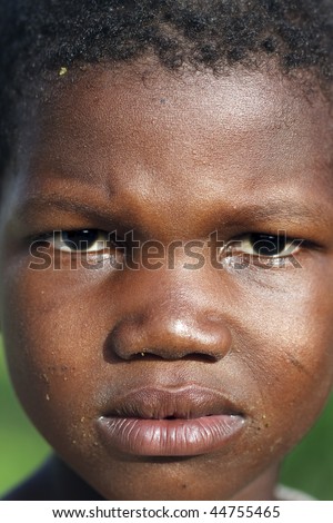 BURKINA FASO - AUGUST 9: Child Bissa ethnic posing, the Bissa represent 4% of the population of Burkina Faso, August 9, 2009 in Country Bissa, Burkina Faso