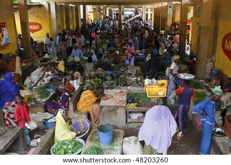 MOPTI - AUGUST 16: Women in the market, each day hundreds of women flock to the fruit and vegetable market to buy or sell food, August 16, 2009 in Mopti, Mali