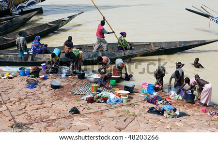 MOPTI - AUGUST 16: Women washing in the river, the lack of resources means that the population use the Niger river for washing and grooming, August 16, 2009 in Mopti, Mali