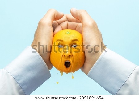 The employer squeezes all the strength or juice out of the employee. Coming up with ideas, squeezing creativity out of yourself. Hands pour out juice from an orange, an orange with a face. Stockfoto © 