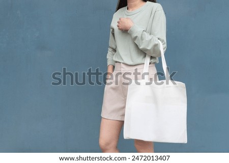 Similar – Image, Stock Photo A woman holds a label on which the word unvaccinated is written in the camera