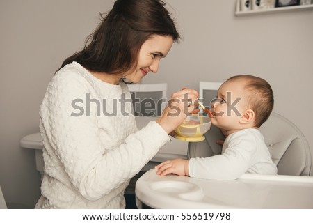 Similar – Image, Stock Photo Mother with her baby at home