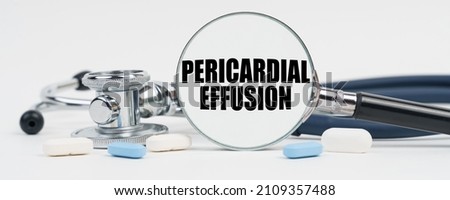 Medicine and health concept. On a white surface are pills, a stethoscope and a magnifying glass inside which is written - Pericardial effusion Photo stock © 