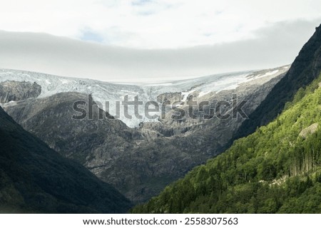 Similar – Foto Bild Von Wasser umgebener steiniger Gipfel in felsigem Tal