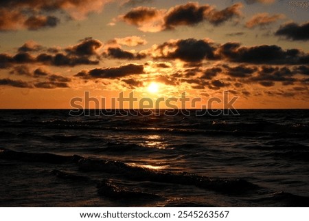 Similar – Image, Stock Photo sunset over the baltic sea, portrait of a young woman standing on the beach