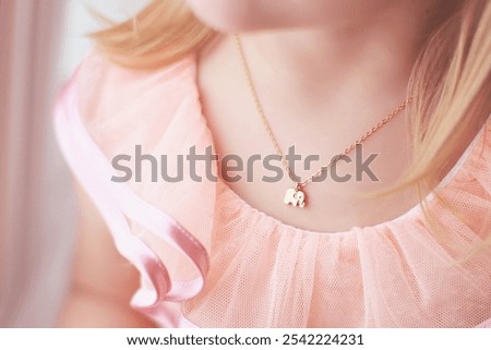 Similar – Image, Stock Photo Little blonde sweet girl is noodles with tomato sauce and smears her face with red sauce with her hand, she holds the small spoon in her hand, over a bowl and looks curiously into the camera, at home in the apartment.