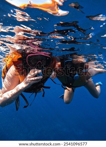 Similar – Image, Stock Photo Diver surrounded by bubbles jumping in water