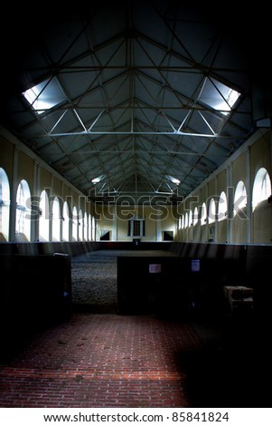 An image of a dark and moody looking horse riding school in the UK