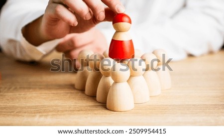 Similar – Image, Stock Photo wooden figures of men stand on a beige background and a red plastic magnifying glass. Recruitment concept, search for talented and capable employees, career growth