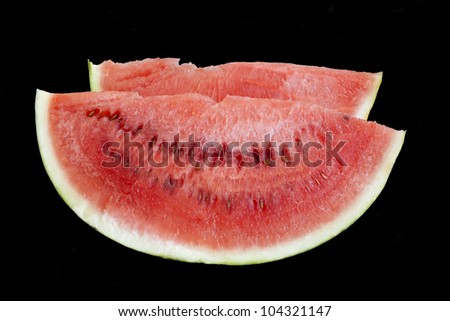 Slice  ripe watermelon over black background