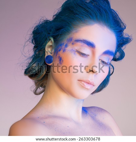 Creative makeup. Blue, indigo makeup. Creative eye make-up, hair