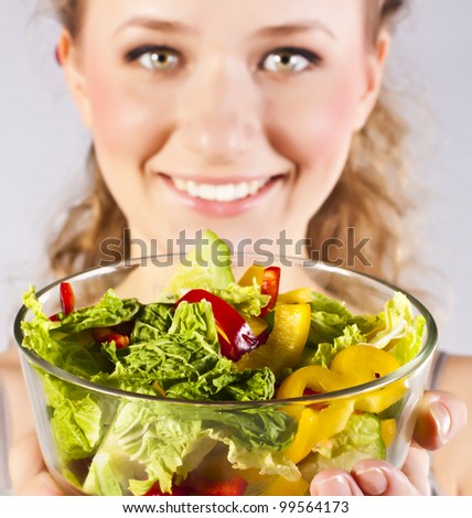 Happy healthy woman with salad