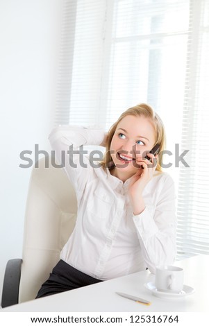happy office girl talking on phone at break