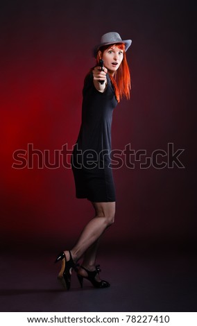 crazy woman with pistol run away, red background