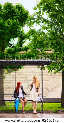 Two Girls at Bus Stop