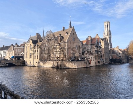 Similar – Image, Stock Photo Serene canal in old city district with aged buildings