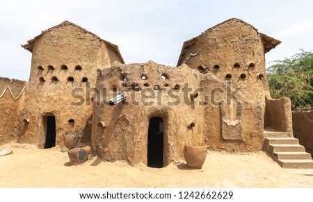 Traditional mud built houses in Gaoui, Chad N'Djamena. Old ancient houses, located in Sahel desert and Sahara. Hot weather in desert climate on the Chari river. Foto stock © 