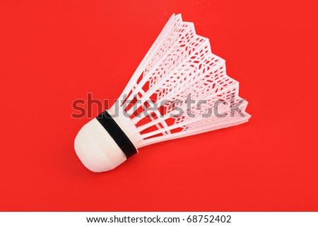 Flounce for game in badminton on a red background
