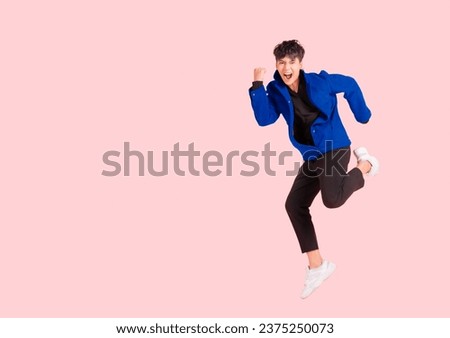 Similar – Image, Stock Photo Handsome young man jumping against grey wall