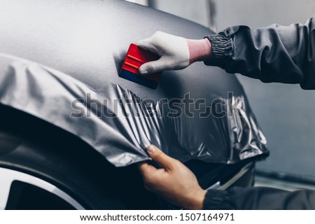 Similar – Image, Stock Photo Mechanic putting on protective mask in workshop