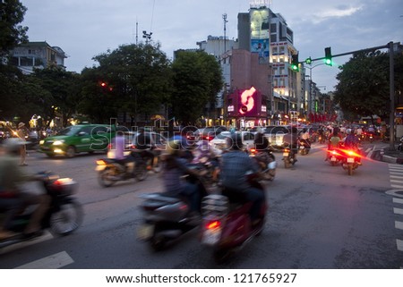 HANOI - AUGUST 7:Unidentified riders ride motorbikes on busy road on August 7, 2012 in Hanoi, Vietnam.Motorbike is the most favorite vehicle for Hanoians