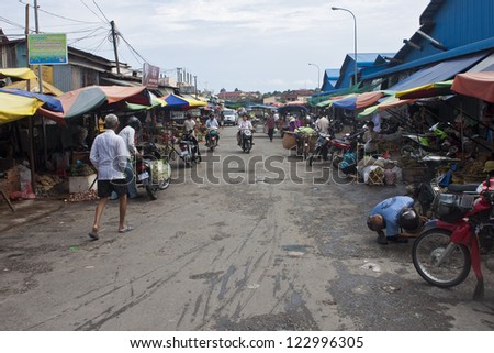 SIHANOUKVILLE, CAMBODIA - JULY 20: People shop on local market on July 20, 2012 in Sihanoukville, Cambodia. Sihanoukville is a city located in south east Cambodia, with population about 200,000.