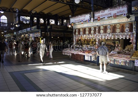 BUDAPEST - AUGUST 10: Tourists and local customers in the Great Market Hall on August 10, 2012 in Budapest, Hungary. The city\'s largest covered market hall opened in 1897.