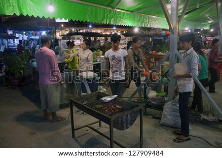SIEM REAP, CAMBODIA - JULY 14: Street restaurant on July 14, 2012 in Siem Reap, Cambodia. Siem Reap is a city located in north west Cambodia, with population about 175,000.