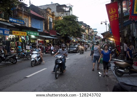 HANOI - AUGUST 7:Unidentified riders ride motorbikes on busy road on August 7, 2012 in Hanoi, Vietnam.Motorbike is the most favorite vehicle for Hanoians