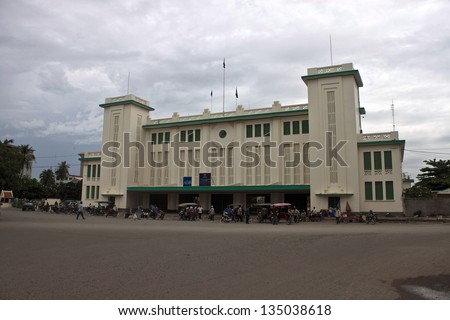 PNOM PENH, CAMBODIA - JUL 17: People in front of a train station in Pnom Penh, Cambodia on Jul 17, 2012. Pnom Penh is the capital and largest city of Cambodia.. Metropolitan area is home to 2.2 mil.