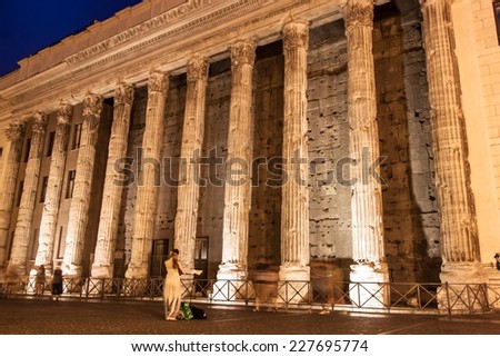 ROME - JUN 24: Tourists visit Temple of Emperor Adrian on Jun 24, 2014 in Rome, Italy. According to Euromonitor, Rome is the 3rd most visited city in Europe (5.5m international tourist arrivals 2009).