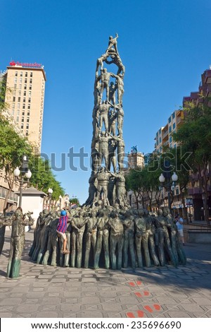 TARRAGONA, SPAIN - AUG 14: Monument of human tower (castell) on Aug 14, 2012 in Tarragona, Spain. On Castells were declared by UNESCO to be Heritage of Humanity.
