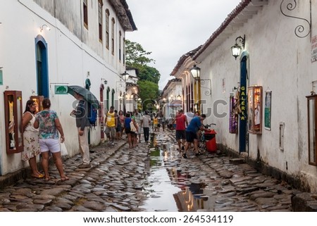PARATY, BRAZIL - JANUARY 30, 2015: People walk in a narrow street an old colonial town Paraty, Brazil