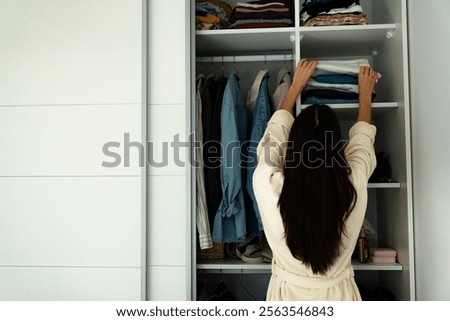 Similar – Image, Stock Photo Young woman in dressing room of swimming pool