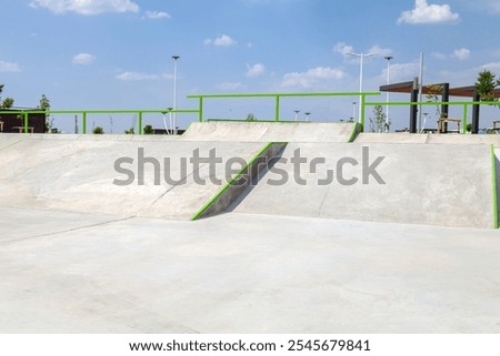 Similar – Image, Stock Photo Skateboard arena in the evening sun, cordoned off with red and white flutterband | Corona Thoughts