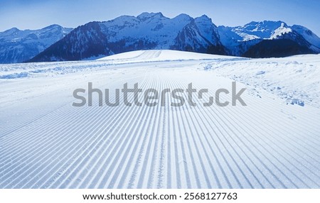 Similar – Image, Stock Photo Groomed ski trails for cross-country skiing in winter landscape in valley Studen, Switzerland famous for winter sport. Flat landscape is surrounded by mountains and illuminated by midday sun.