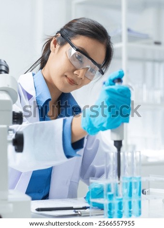 Similar – Image, Stock Photo Focused scientist examining chemical solution in laboratory