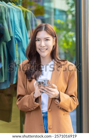 Similar – Image, Stock Photo Asian woman, posing near a tobacco drying shed, wearing a white dress and green wellies.