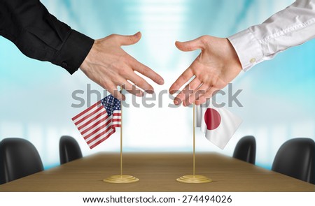 United States and Japan diplomats agreeing on a deal