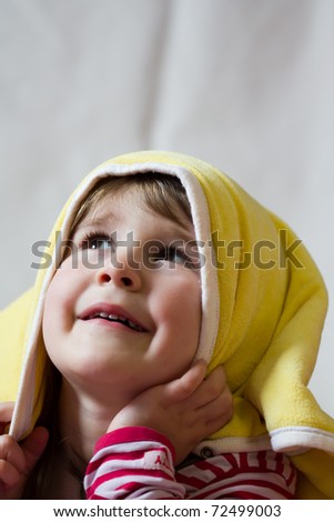 Little girl under blanket