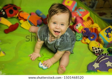 Similar – Image, Stock Photo Caucasian blonde baby seven months old lying on bed at home. Kid wearing cute clothing yellow color