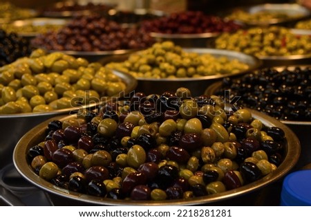 Similar – Image, Stock Photo Olives. A variety of green, black and red olives, with leaves, shot from the top with a place for text