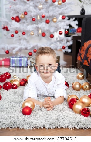 little boy getting ready for the holiday. Happy New Year and Merry Christmas!
