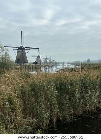 Similar – Image, Stock Photo View on several windmills, wind generators, turbines, producing renewable clean energy by converting kinetic energy