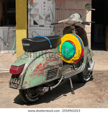 Similar – Image, Stock Photo Classic green Vespa Scooter parked in the sidewalk.