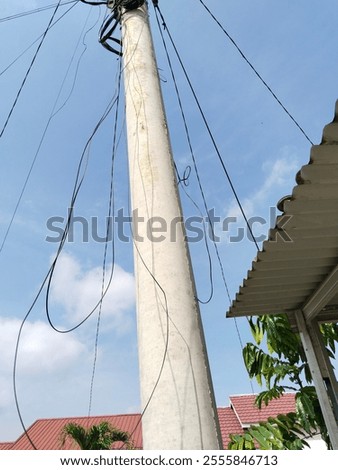 Similar – Image, Stock Photo Power poles in front of evening sky, taken through a power pole in the foreground, cropped, orange-black