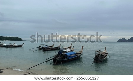 Similar – Image, Stock Photo small boats parked on the sand of a beach during sunset