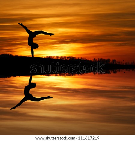 silhouette of gymnast in sunset