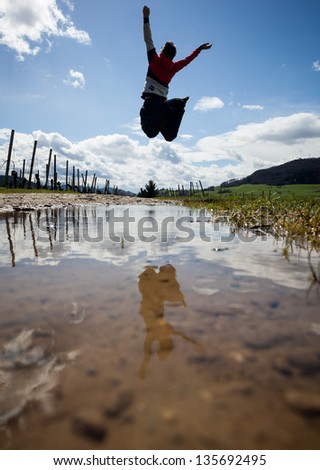 man jumps in black forest