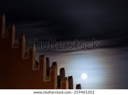 full moon over roof